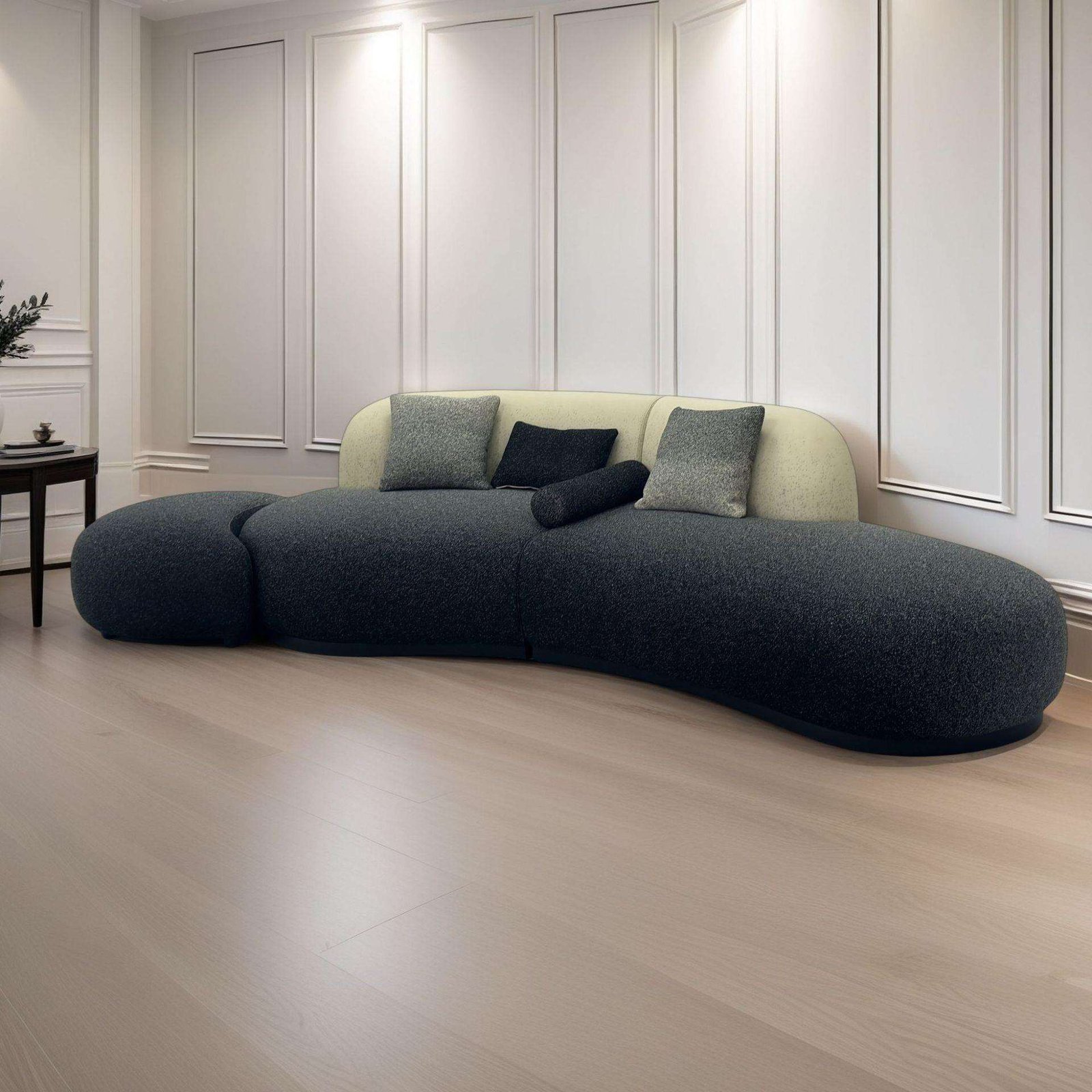 Dark Pebble Chaise Sofa with Cream Back Pillows and Organic Low Form