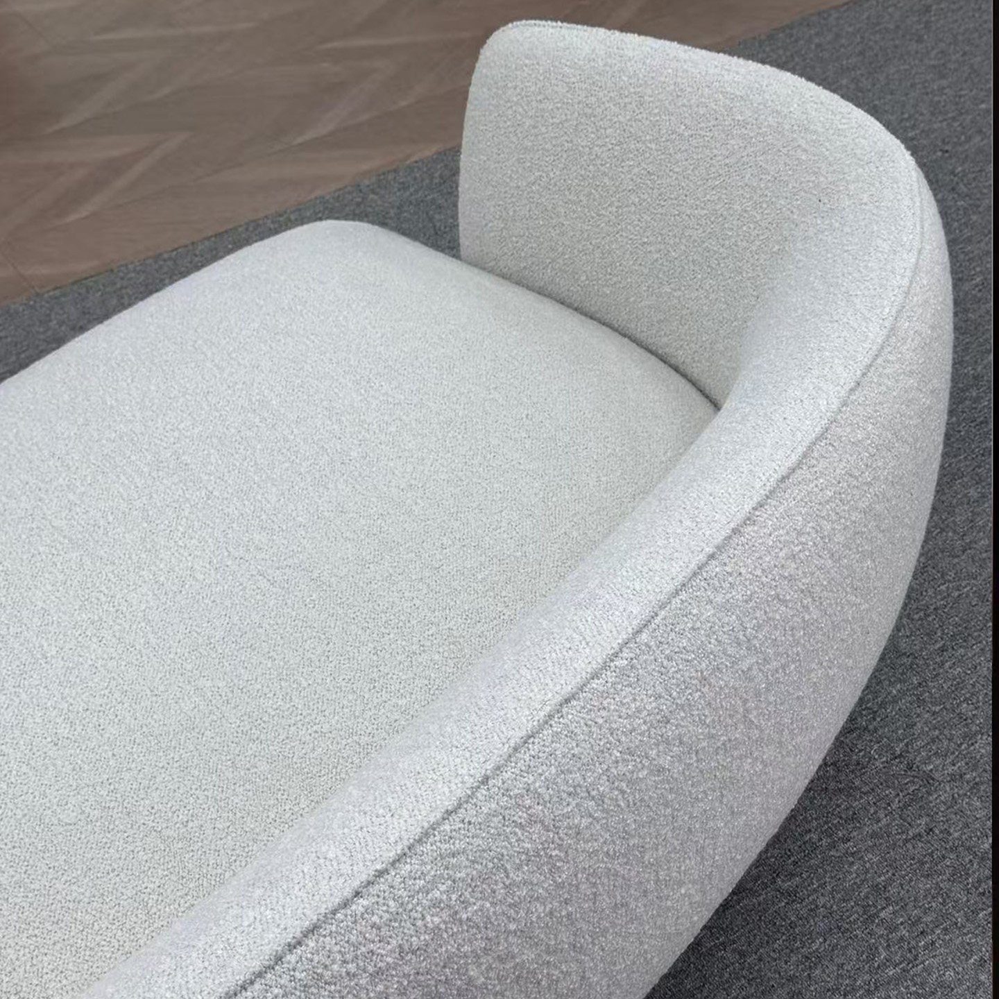 Cream Wave Sofa with Open Undercut Base and Pillow Backrests