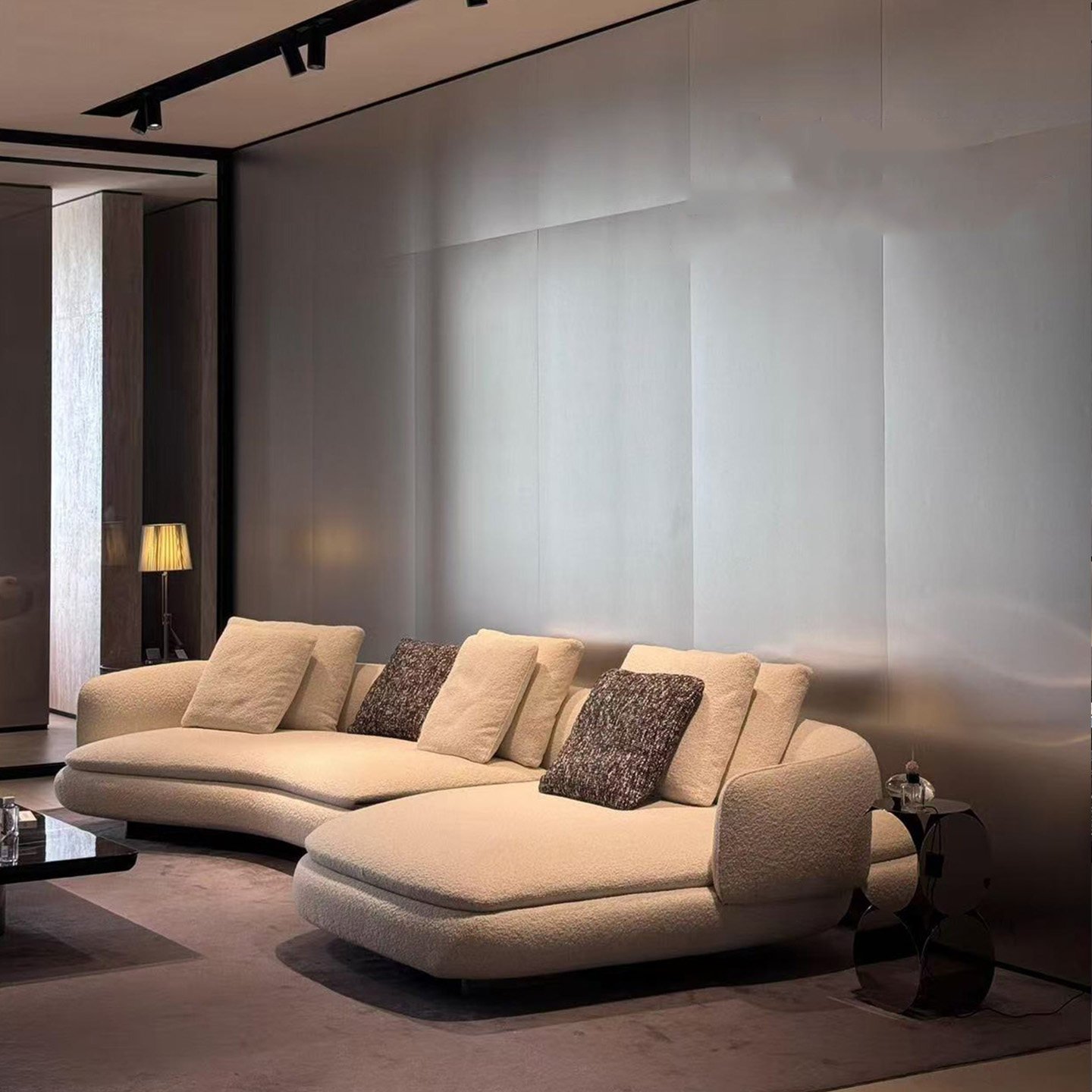 Cream Wave Sofa with Open Undercut Base and Pillow Backrests