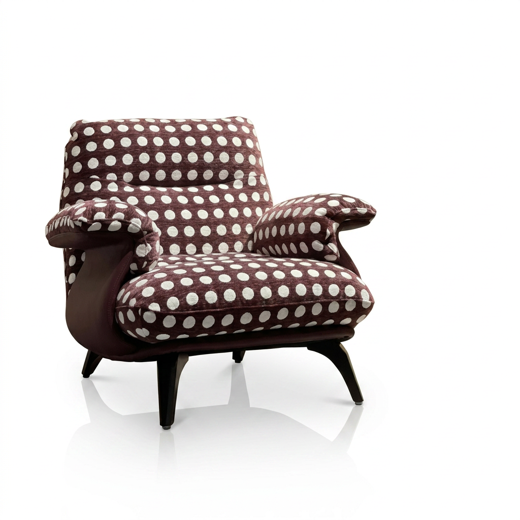 Brown Polka Dot Lounge Chair with Wide Cushions and Black Tapered Legs