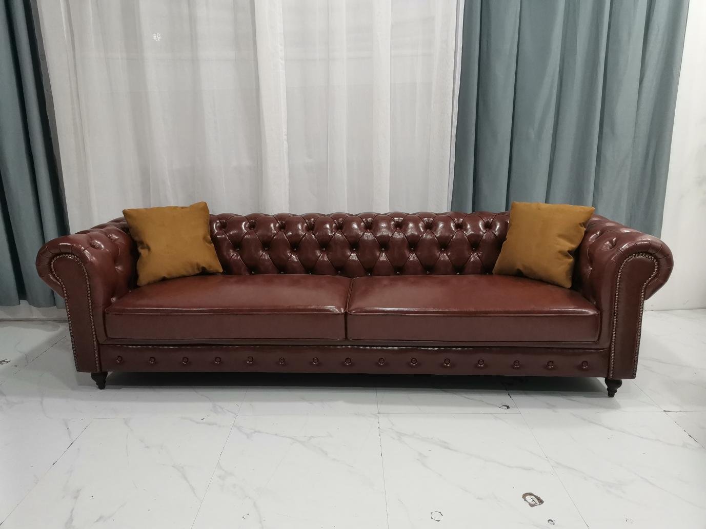 Burgundy Chesterfield Sofa with Deep Tufting and Nailhead Arms