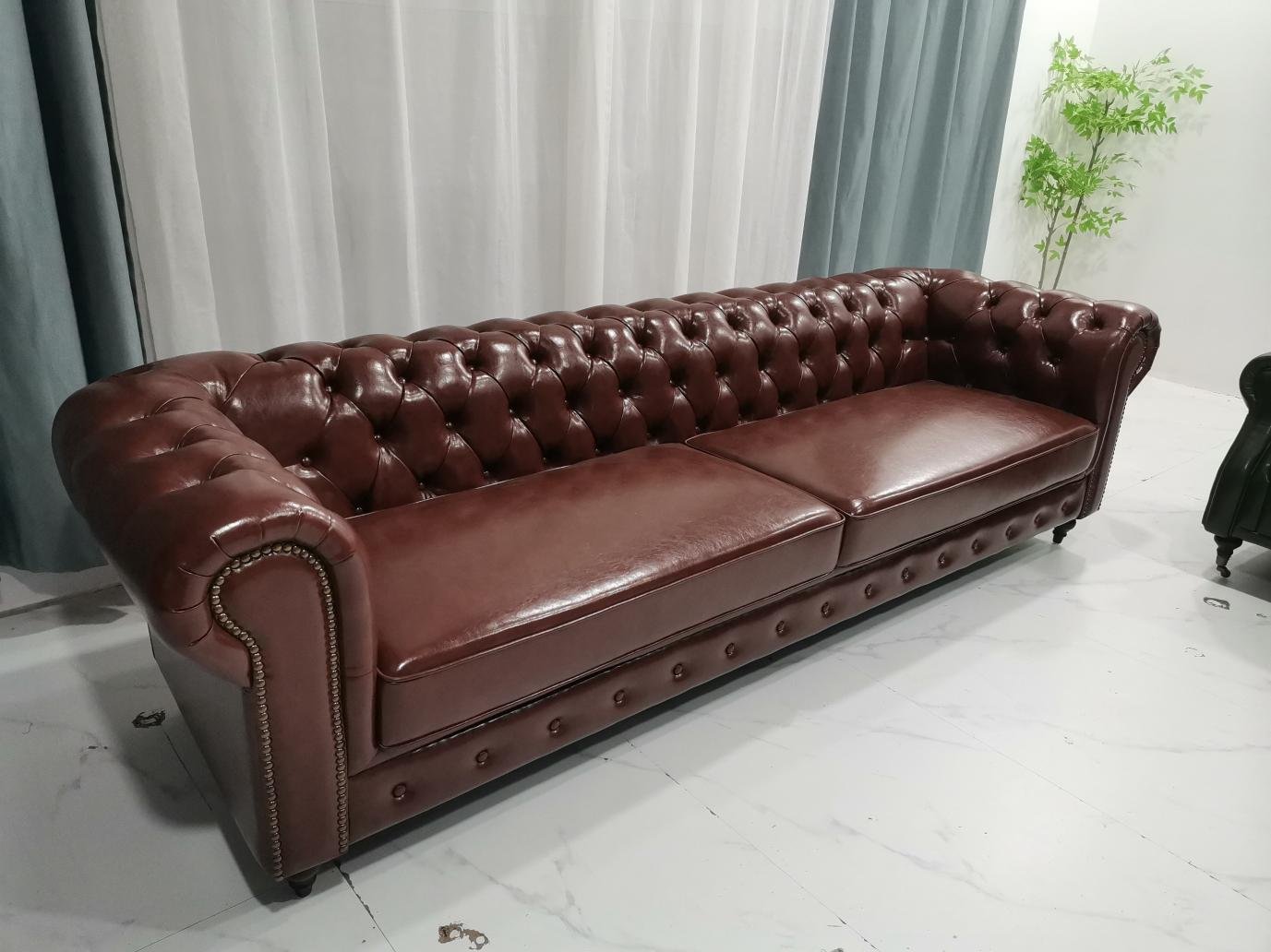 Burgundy Chesterfield Sofa with Deep Tufting and Nailhead Arms